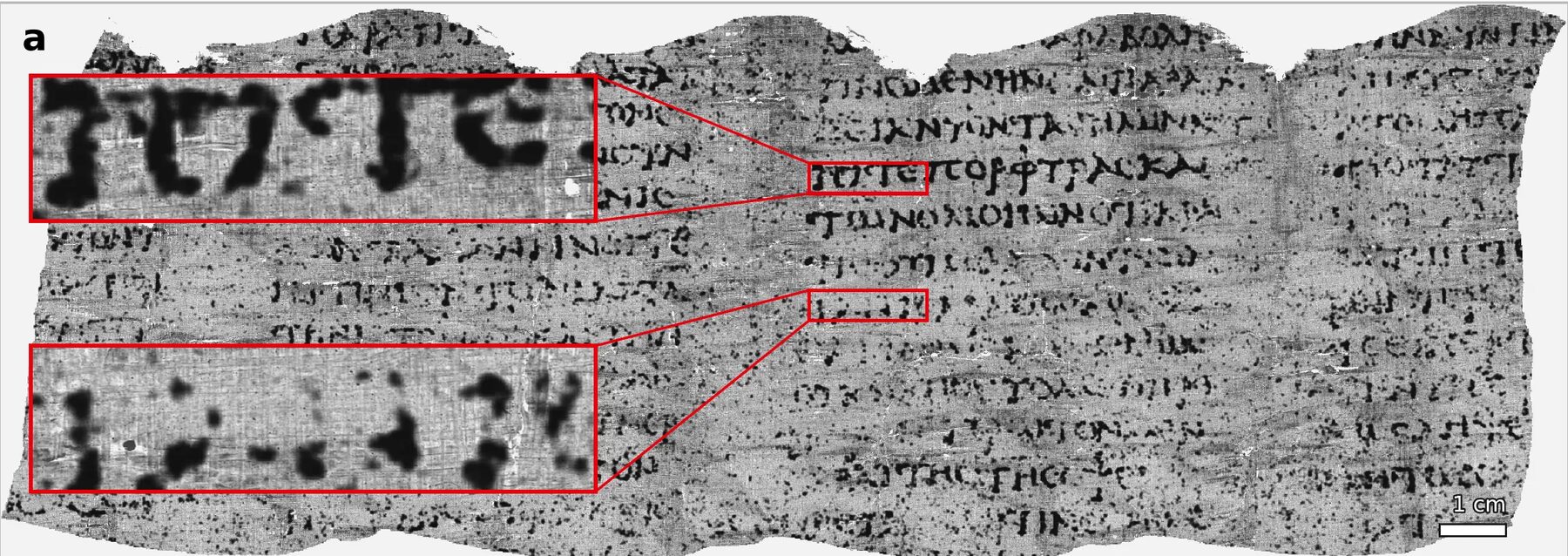 A wide strip of gray, mottled papyrus covered in rows of dark Greek capital letters, with two red boxes enlarging a few letters at the left