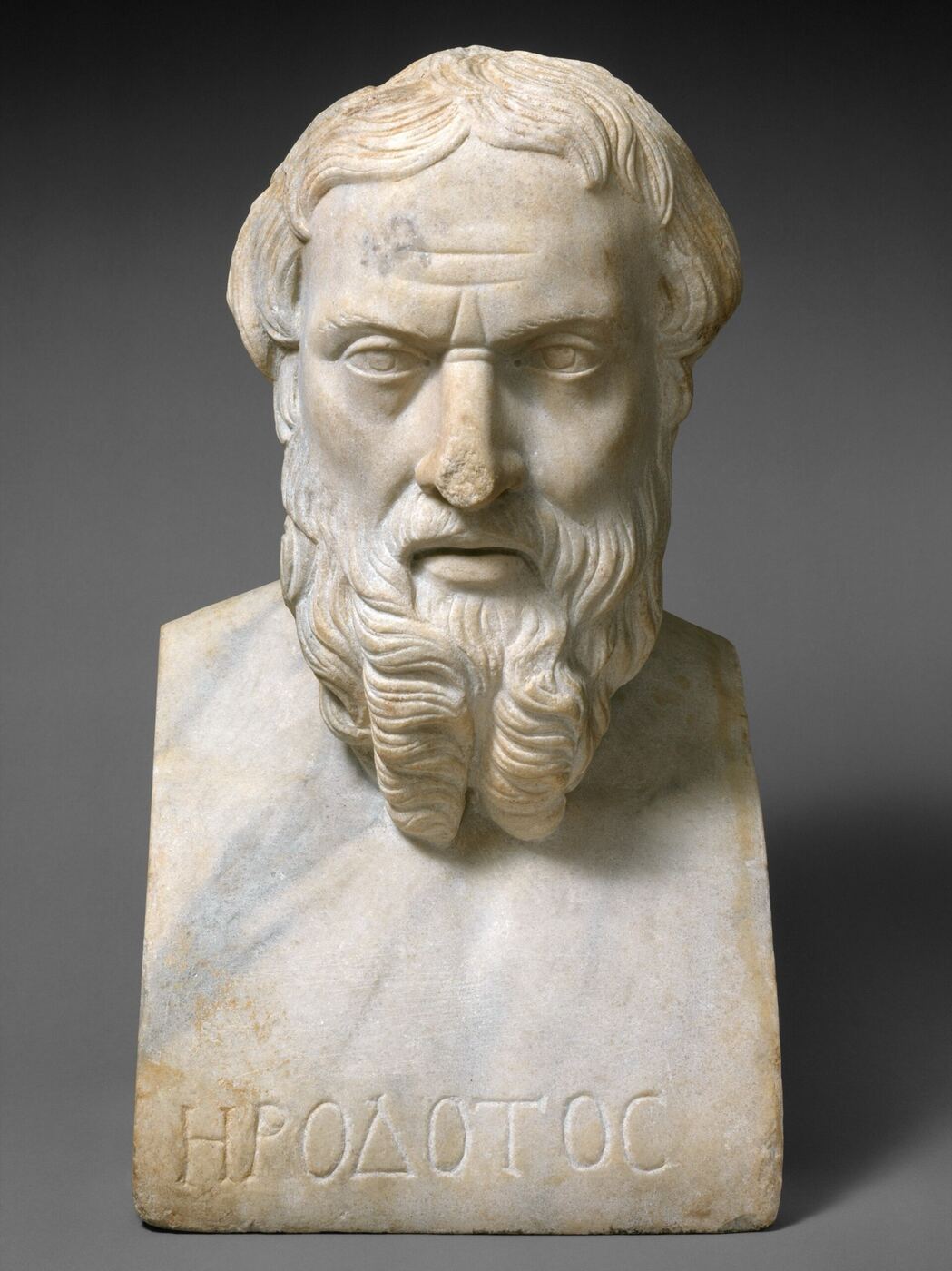 A marble portrait bust of a bearded man